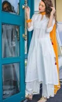 Show details for White, long-length A-line style kurta, paired with white palazzos and an orange dupatta. Picture of White, long-length A-line style kurta, paired with white palazzos and an orange dupatta.